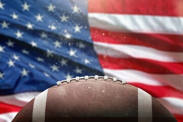 American leather football ball on flag background