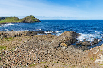 Landscape of Giant's Causeway trail with a blue sky in summer in Northern Ireland, County Antrim....