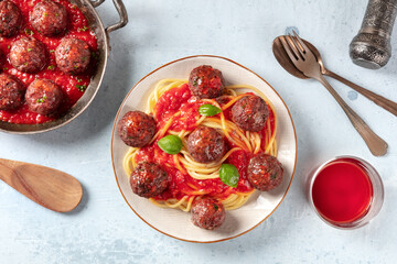 Meatballs with pasta and tomato sauce, overhead flat lay shot