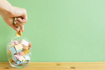 Draw lots. Folded colorful papers in bowl