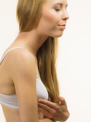 Fototapeta premium Female wearing bra touch her breast