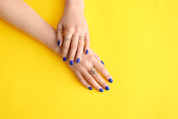 Fototapeta premium Hands with beautiful manicure on color background
