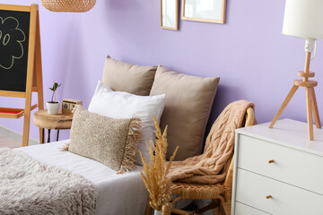 Stylish interior of bedroom with comfortable bed