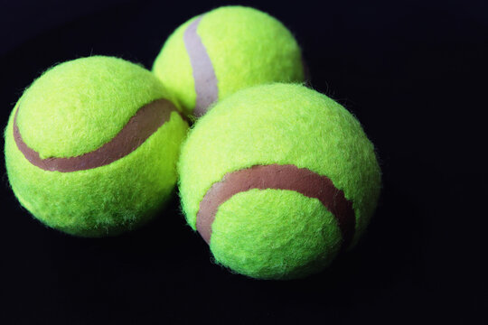 Tennis ball on black background