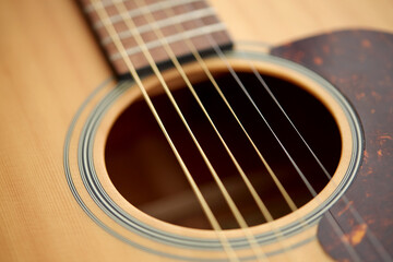 leisure, music and musical instruments concept - close up of acoustic guitar strings