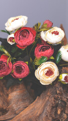 Tea roses on a wooden texture background. Red and white roses, bouquet. Floral vintage background for postcard. Congratulations on the holiday.