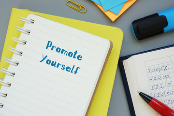 Promote Yourself phrase on the piece of paper.