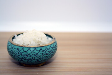 Fototapeta na wymiar White rice for pilaf on a wooden background.