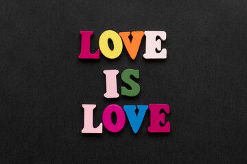 words love is love, notepad with chalk drawn heart. Valentine's day concept