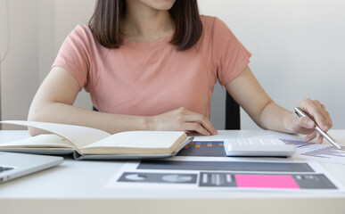 Accounting businesswomen are calculating income-expenditure and analyzing real estate investment data, Dedicated to the progress and growth of the company, Financial and tax systems concept.