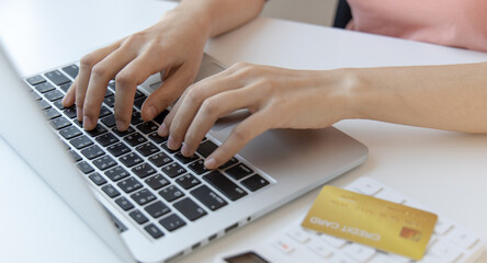 Online product purchase, Businesswoman use laptop register via credit cards to make online purchases, Shopping and mail, credit card online security, Online shopping concept.