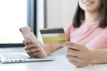 Businesswoman use mobile phones to register for security Online with a credit card to buy products online through application, Online shopping or Internet technology concept.