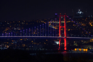 Obraz premium Night view of Bosporus bridge. Lights of Istanbul city.