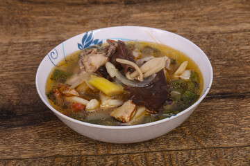 Thai style soup with meat and mushrooms