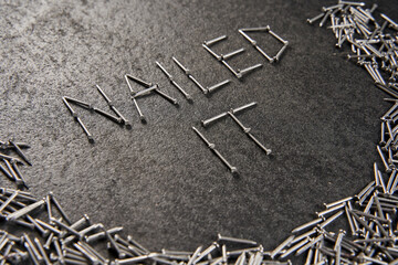 "NAILED IT" written with nails
