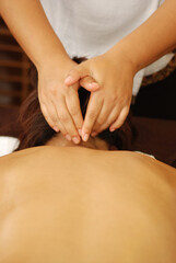 Massage of body for young woman in beauty salon