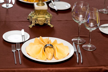 beautifully laid tables with glasses   at morning in restaurant