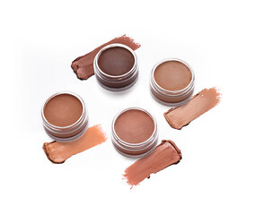 Face foundation and strokes isolated on white