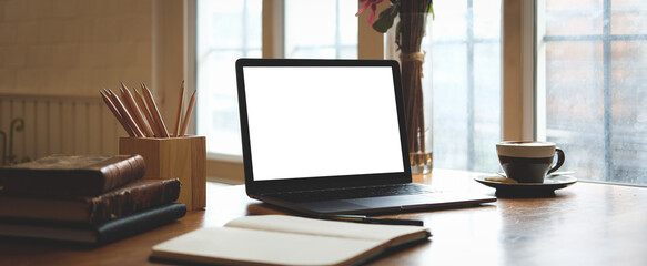 Modern workspace with computer with blank screen and equipment on white table.Blank screen for your information.