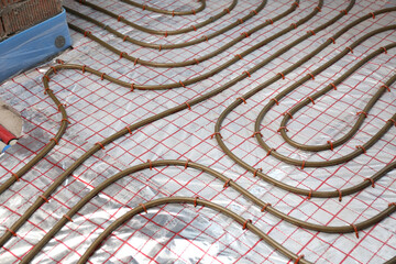 Installation of underfloor heating system in building