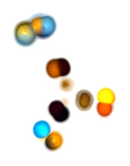 Abstract colorful spots scattered on white. Cell division in microscope. Fantastic representation, fictional composition.