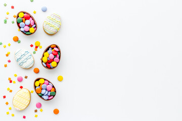 Top view of Easter cookies eggs and sweets. Space for text