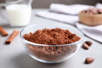 Cocoa powder in bowl on light table
