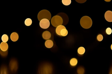 blurry yellow round lights on a dark background