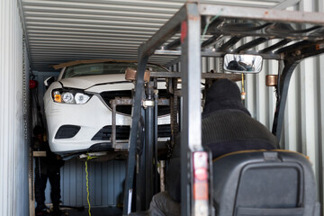 Unloading the car from the container