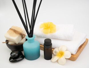 Incense  sticks ,Plumaria  flower ,candle and white towels in spa or bath room on white background ,aromatherapy spa wellness
