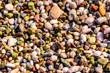 Texture of pebbles at the seaside. Natural background