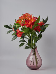 Bright yellow and orange gerbera in a bouquet of flowers. Beautiful bouquet gift for the holiday. Flowering plants as a postcard.