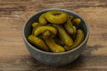 Pickled gherkin in the bowl
