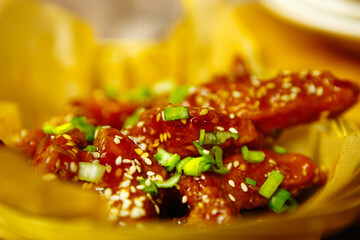 Deep fried chicken strips prepared in deep fryer oven in fast food restaurant for snack