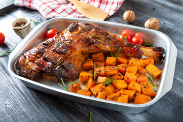 Baked turkey leg with spiced pumpkin slices. Diet menu.