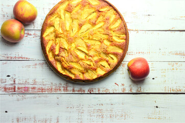 Homemade apple pie on rustic white wooden table