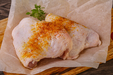 Raw chicken thigh with spices