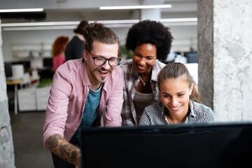 Programmers cooperating at IT company developing apps