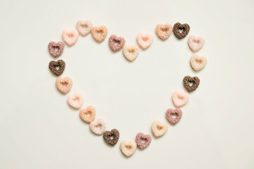 Heart shape breakfast cereals.   Hand made Natural soy wax decoration. Valentine's Day theme. True love symbolism. Creative idea. Warm greetings.