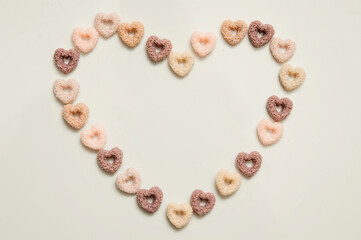 Heart shape breakfast cereals.   Hand made Natural soy wax decoration. Valentine's Day theme. True love symbolism. Creative idea. Warm greetings.