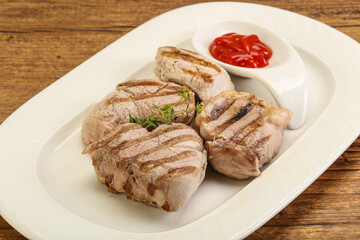 Grilled pork tenderlion with tomato sauce