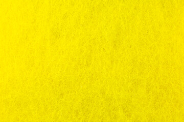 Yellow sponge texture background. Close up, macro photo.