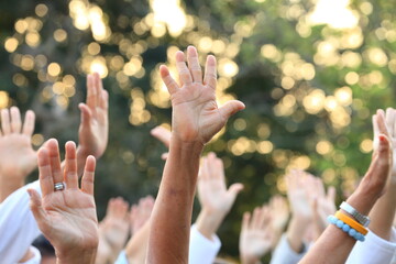 People raise their hands up for protest and uprising in demonstration event for unity and unanimous...