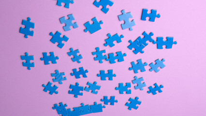 scattered puzzle pieces on colored background