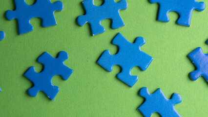 scattered puzzle pieces on colored background