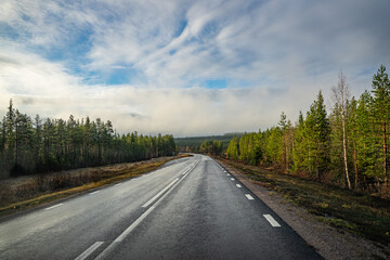 Fototapeta na wymiar Long road through wild nature in Norway