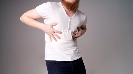 young handsome man feeling pain