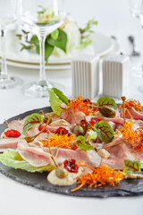 Beautifully decorated catering banquet table with different food snacks and appetizers