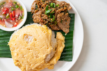 egg on topped rice with grilled pork and spicy sauce