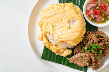 egg on topped rice with grilled pork and spicy sauce